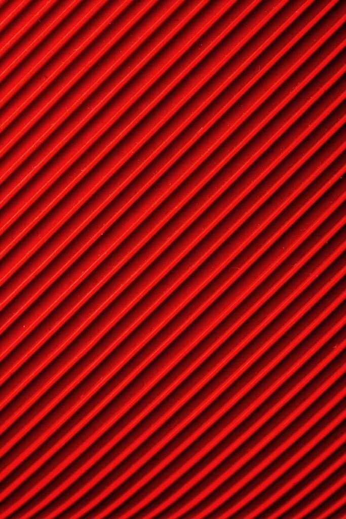 Vibrant diagonal red and black pattern, ideal for abstract backgrounds and designs.