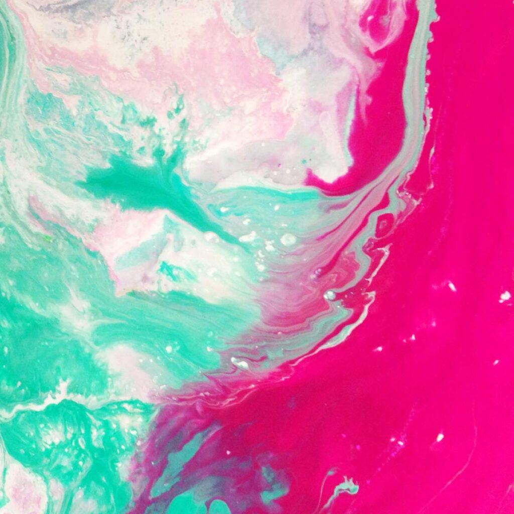 Dynamic abstract painting with vibrant pink and teal swirls creating a modern artistic expression.