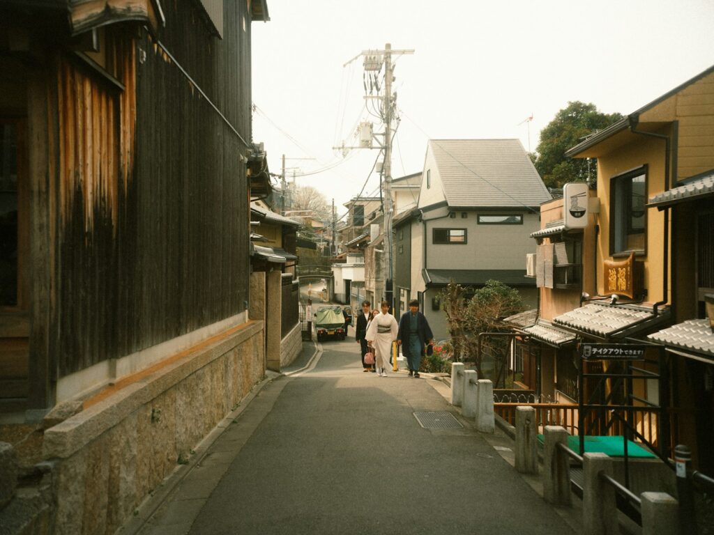 A narrow street in japan with buildings.