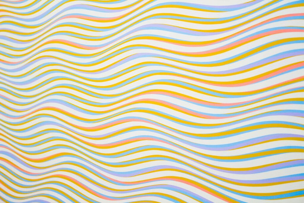 Colorful wavy lines creating an abstract and vibrant background pattern.