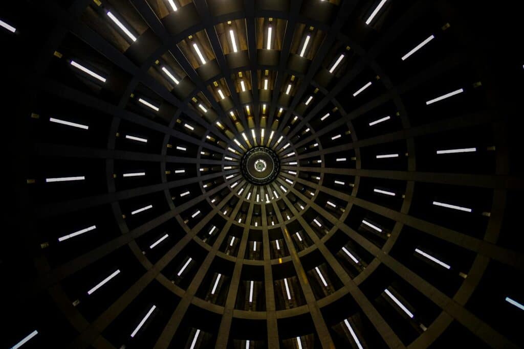 A mesmerizing abstract view of a circular dome with illuminated patterns creating a geometric design.