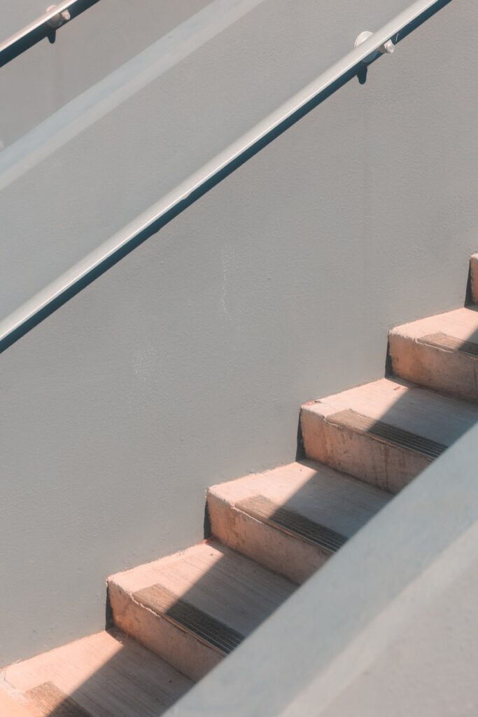 Staircase with handrails and light and shadows.