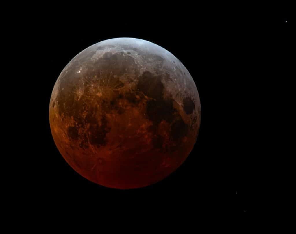 The moon experiences a partial lunar eclipse.