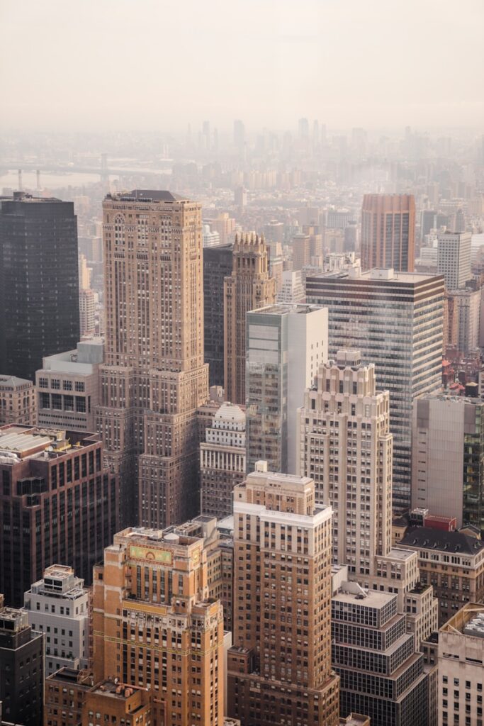 aerial view of city under cloudy sky during day time