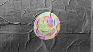 A colourful smiley face on a grey backdrop.