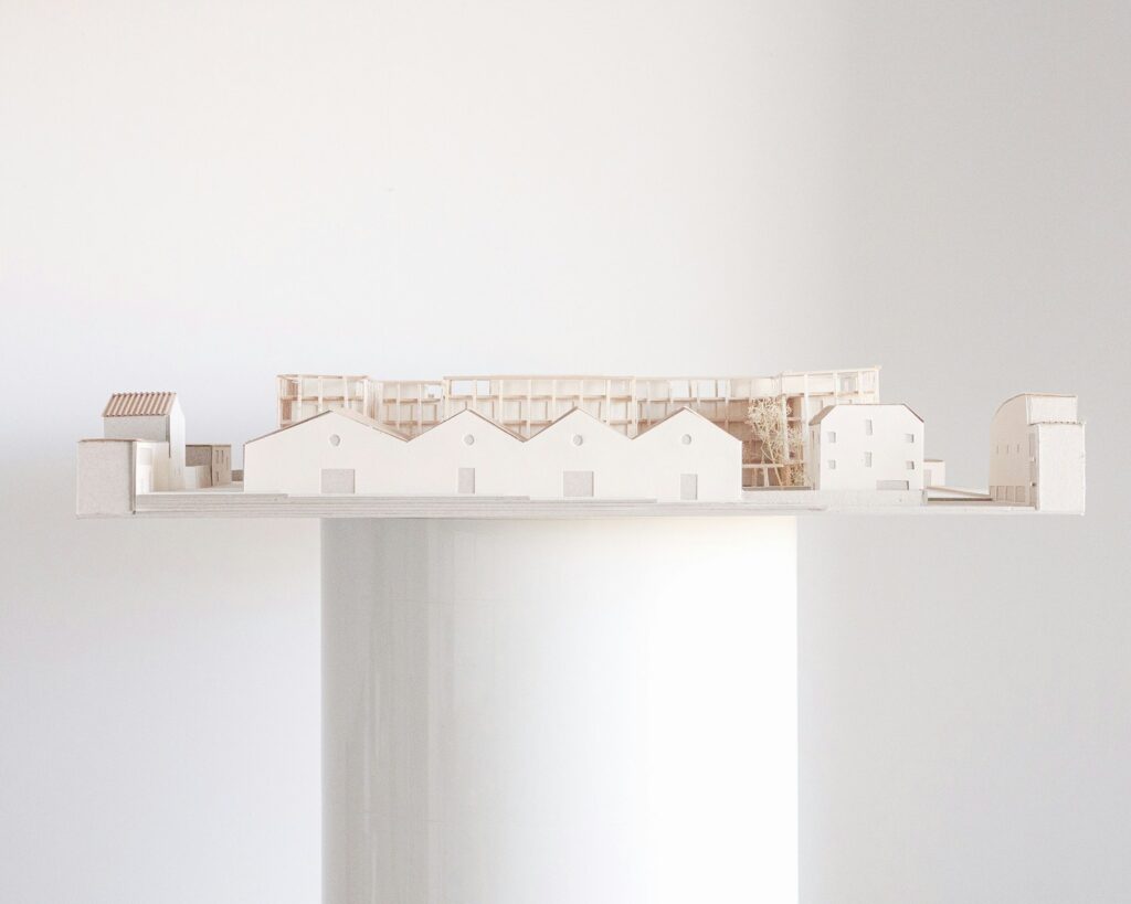 Architectural model of a building on a platform.