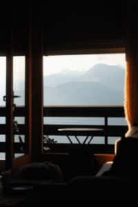 View of mountains seen through an open door.