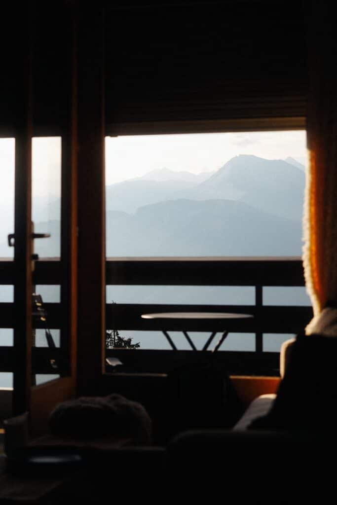 View of mountains seen through an open door.