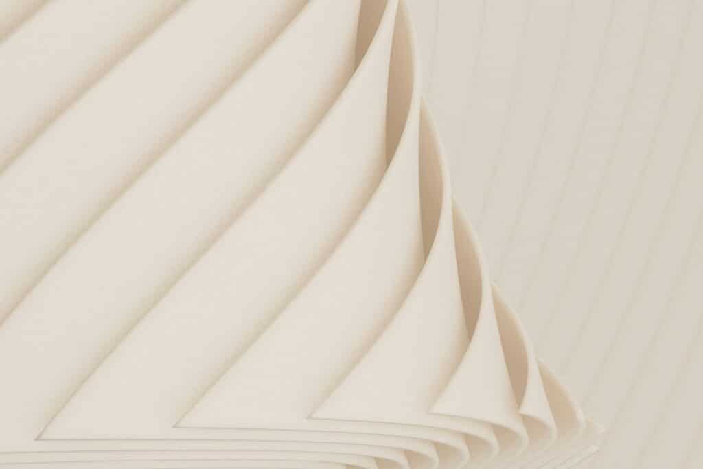 Abstract image of stacked, curved paper.
