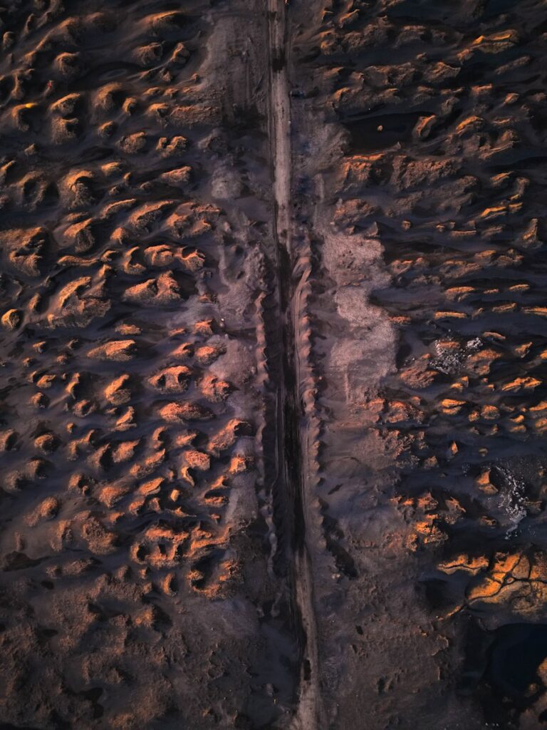 An aerial view of a long, straight road.