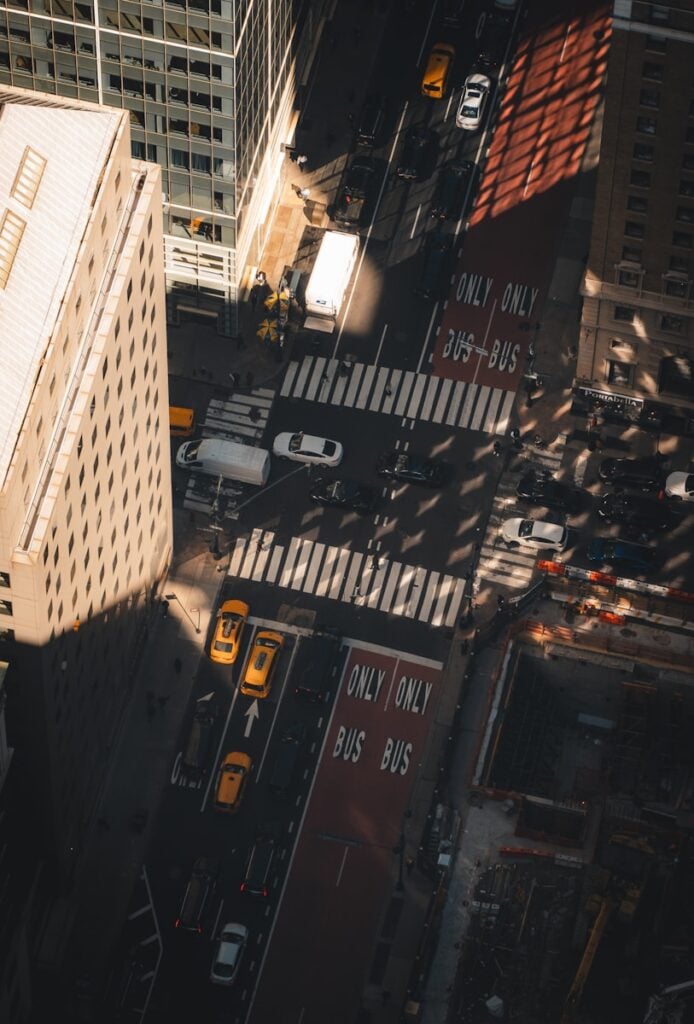 View from above a city street with traffic.