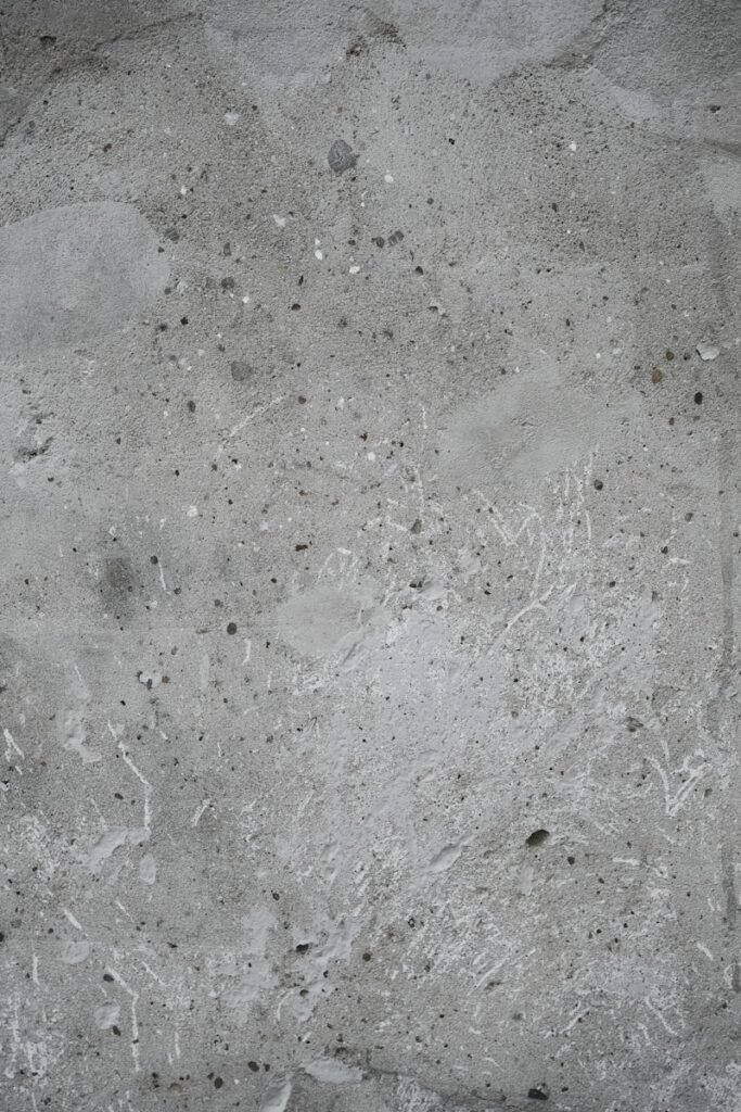 Concrete wall texture is seen up close.